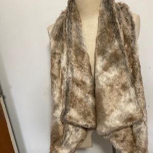 Altar’d State faux fur vest size x small.  Fits like medium